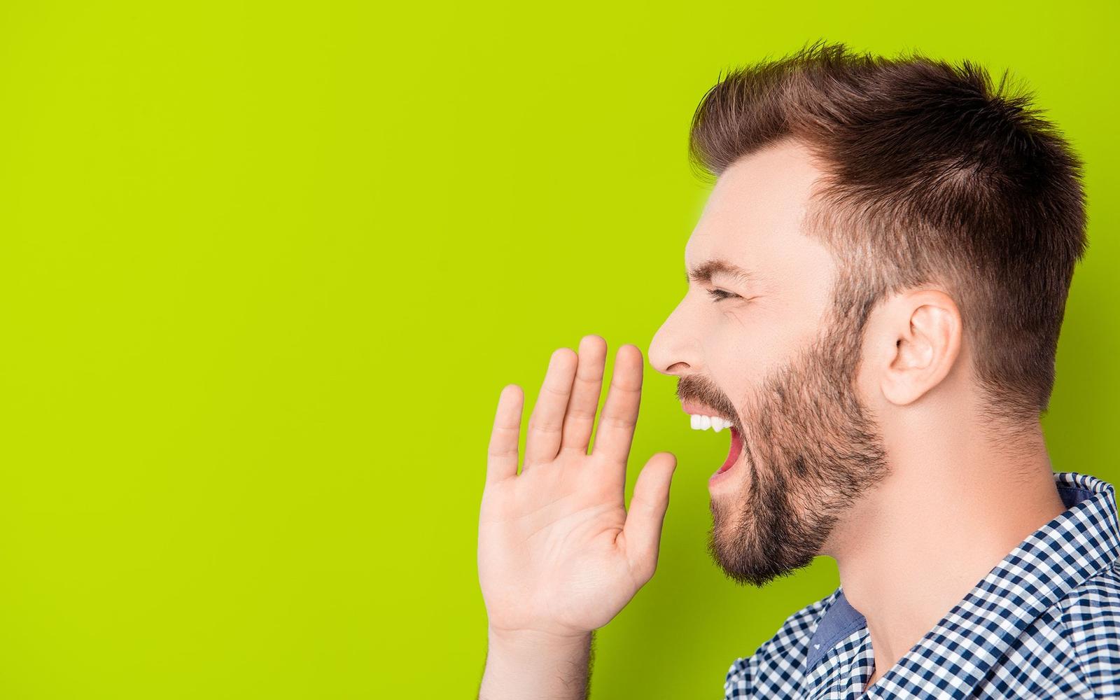 Man saying something with a tone on his voice.