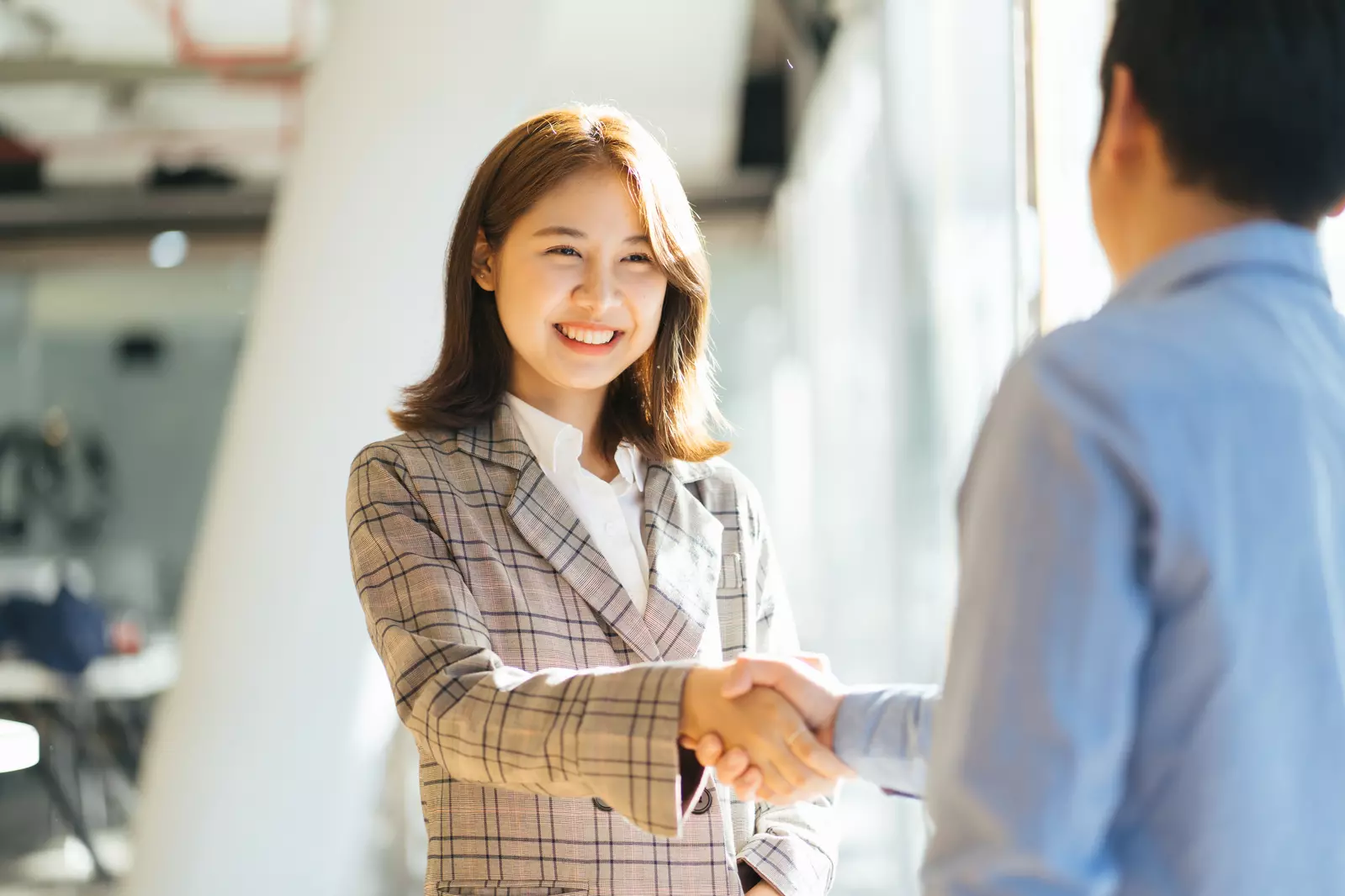 Two people giving a handshake