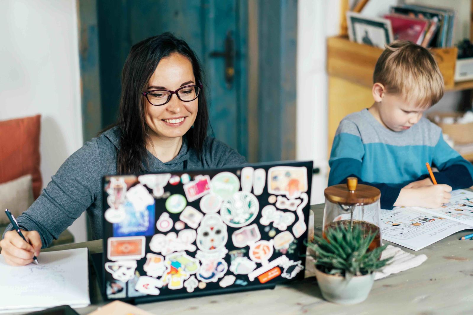 An image of a laptop cover which has been absolutely covered in stickers.