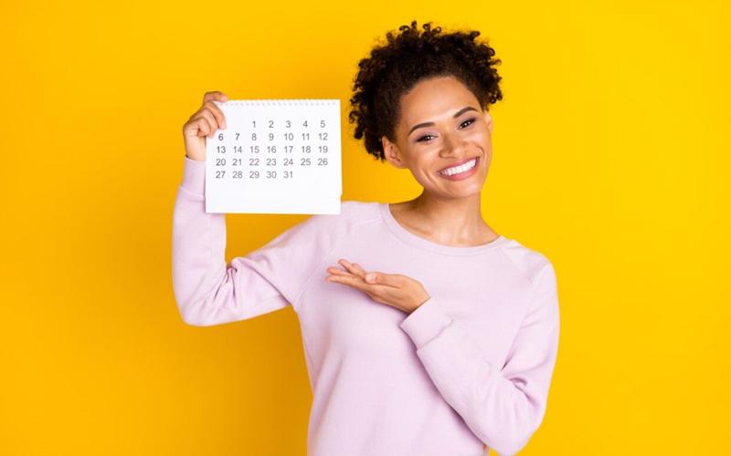 girl carrying a calendar