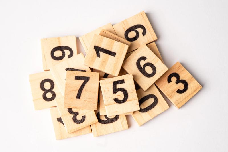 Several wooden blocks with numbers on them.