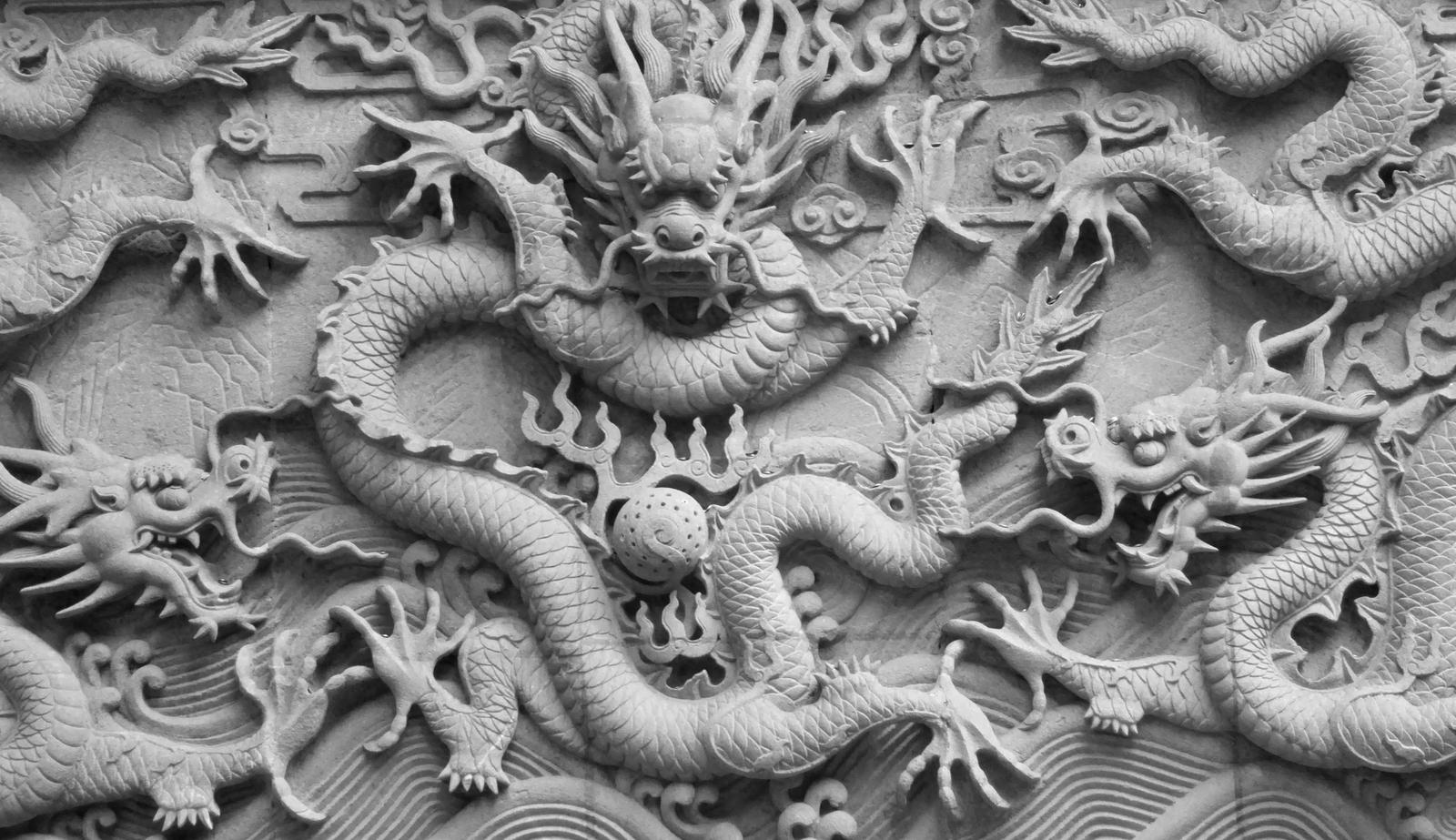 Many dragons carved into stone