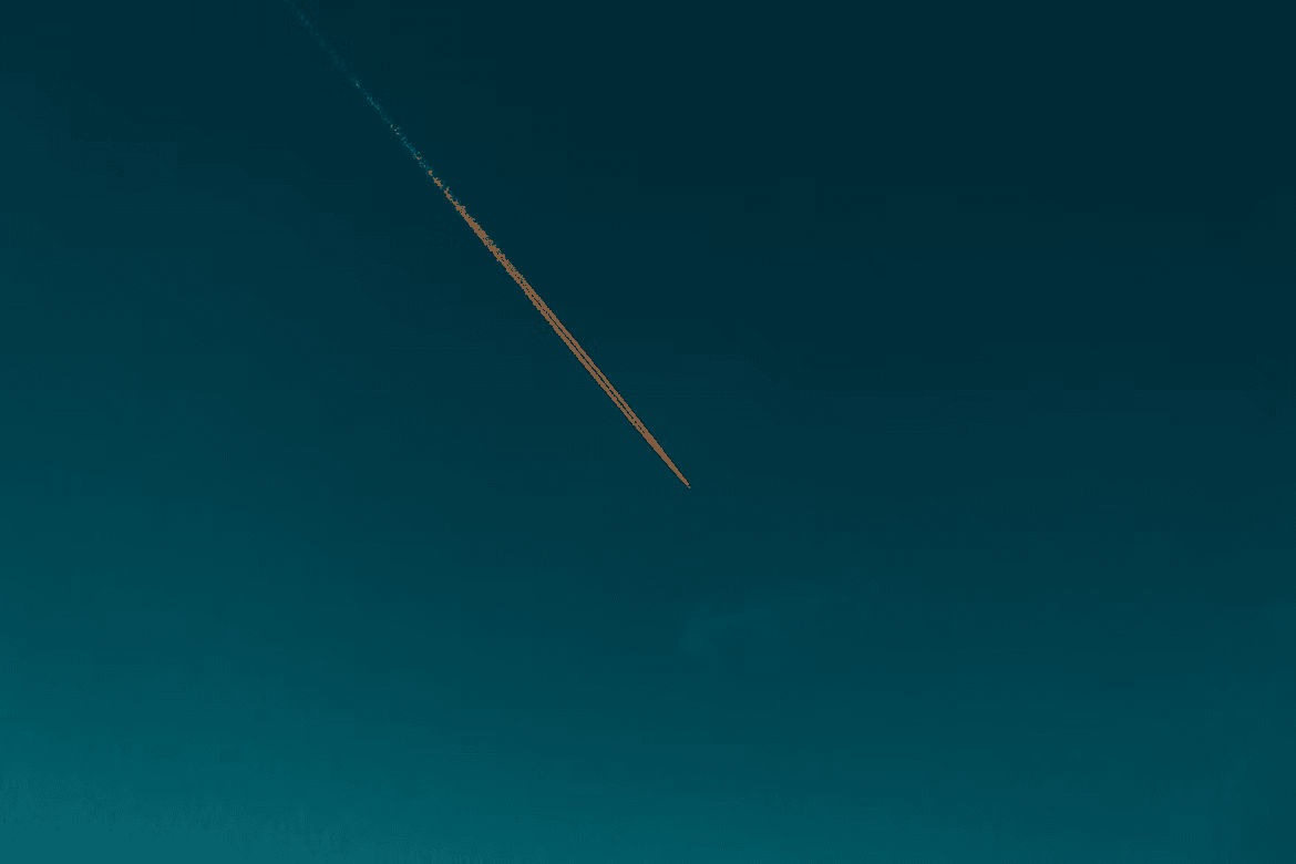 A plane shooting across the sky