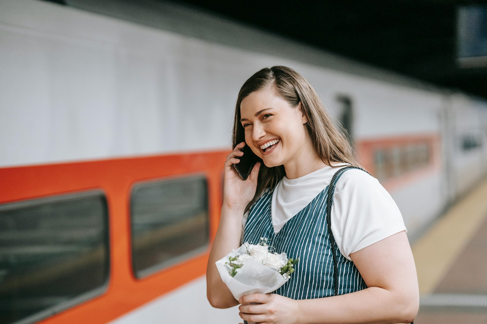 A woman connecting to someone she wishes to talk to via phone