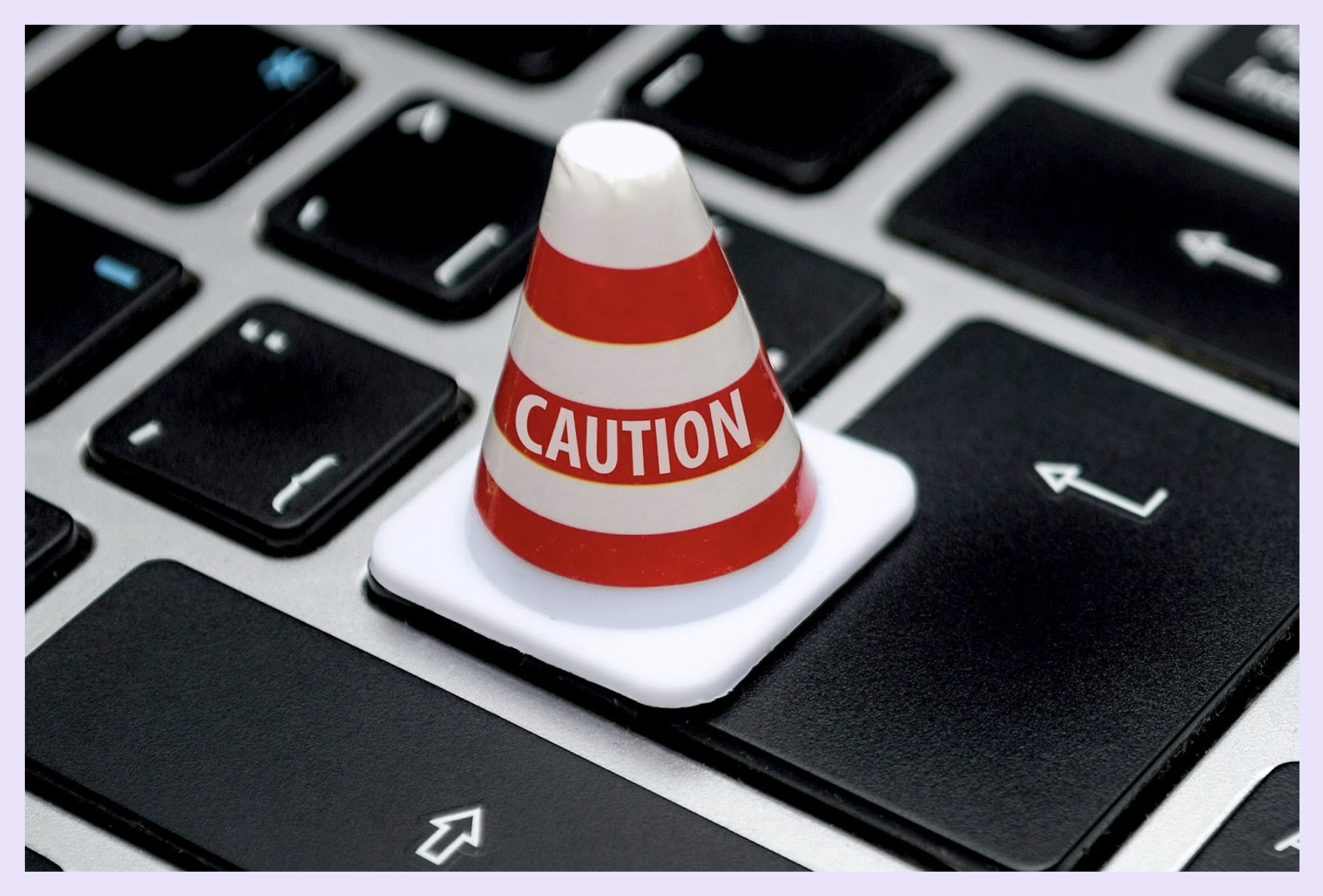 A caution sign on a keyboard, because y'all should really think twice before using some of these