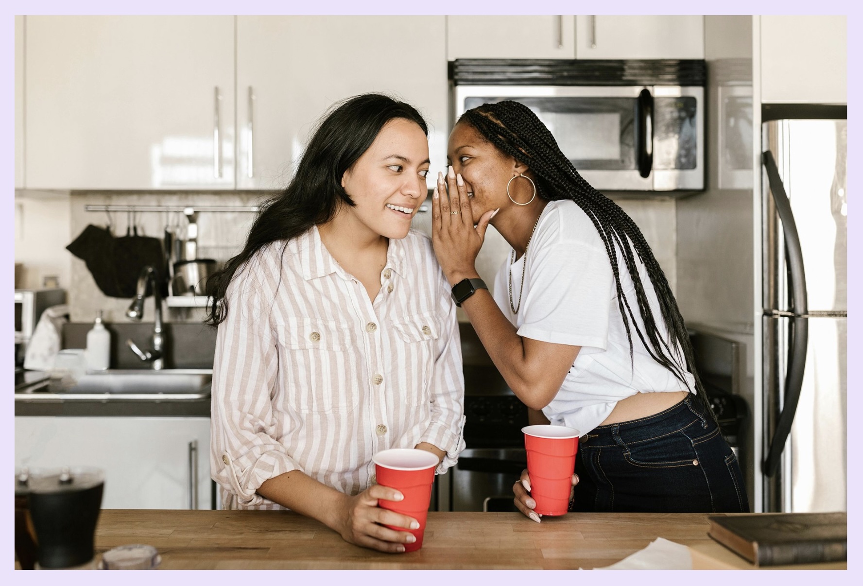 Two girls talking to each other—perhaps engaging in some real talk or spilling the tea