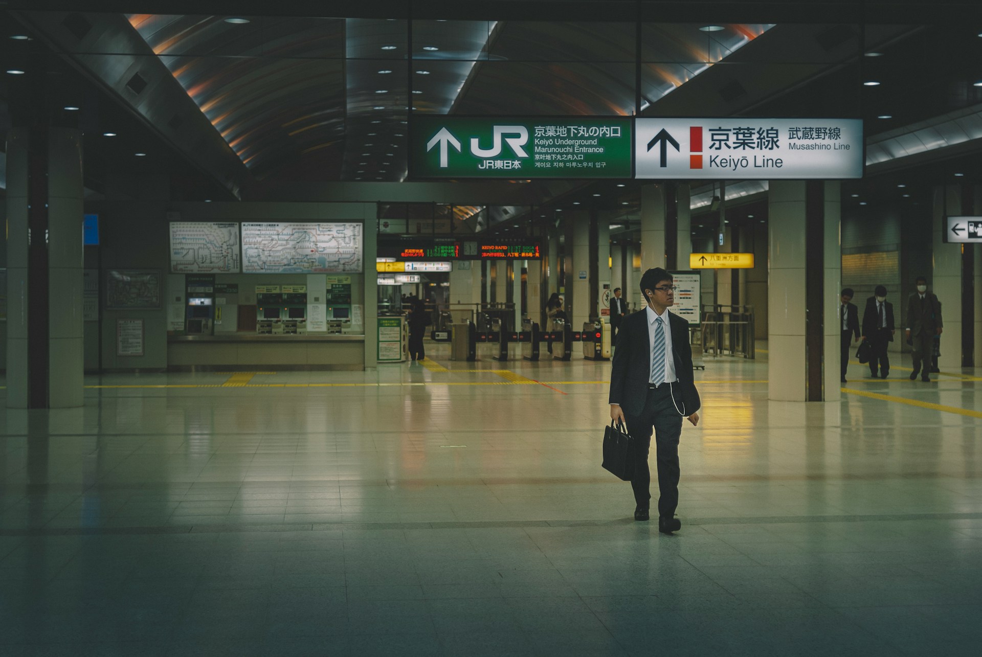 A photo of a Japanese salaryman walking back form the station
