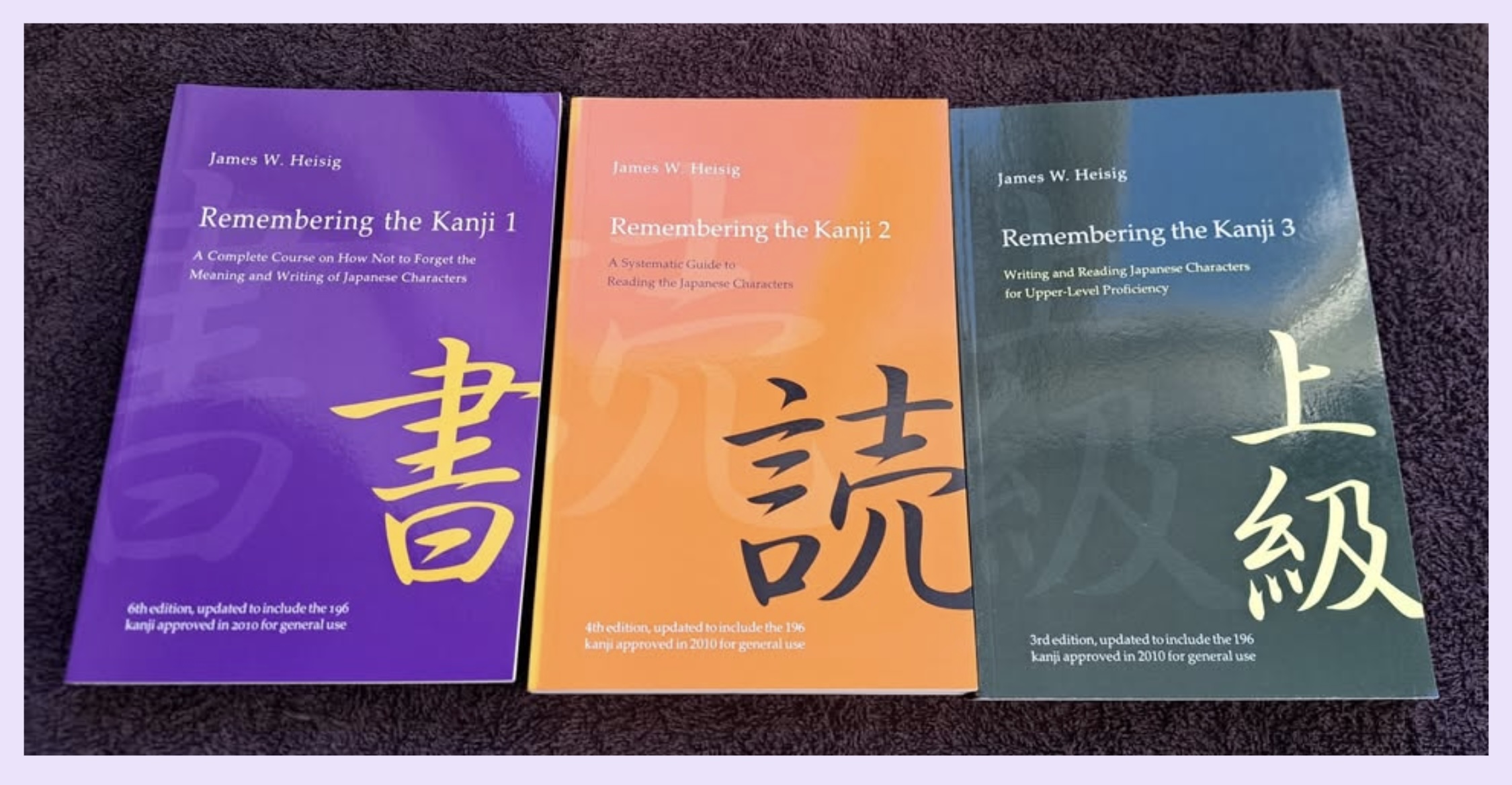 A photograph of Heisig's three Remembering the Kanji books